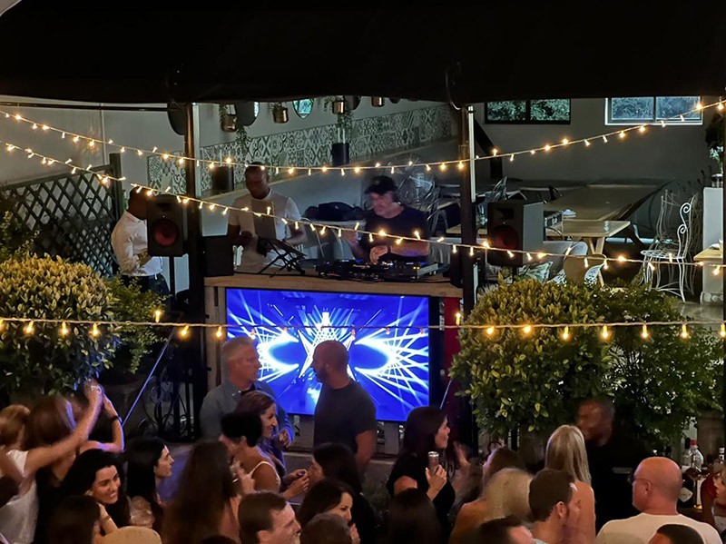 Unlikely Partnership as DJ GOLD Thrills Crowd at The Arbour Cafe Courtyard in Birdhaven