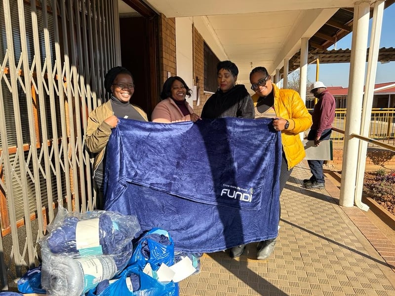 Fundi supports blanket drive to keep children warm and learning