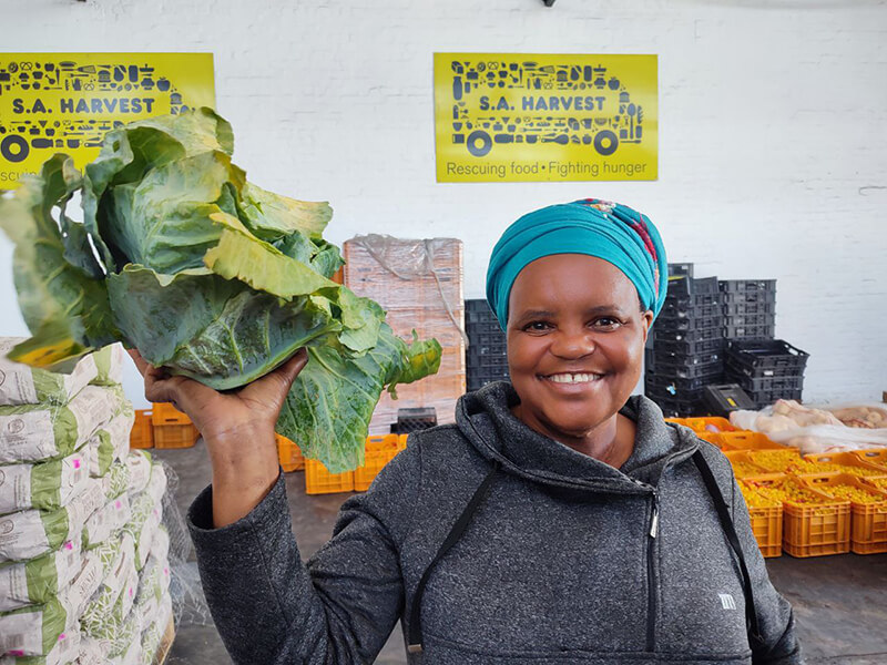 Noludwe_from_Give_Food_Solutions_an_SA_Harvest_Cape_Town_beneficiary_collecting_spinach_donated_by_OneFarm_Share.jpg