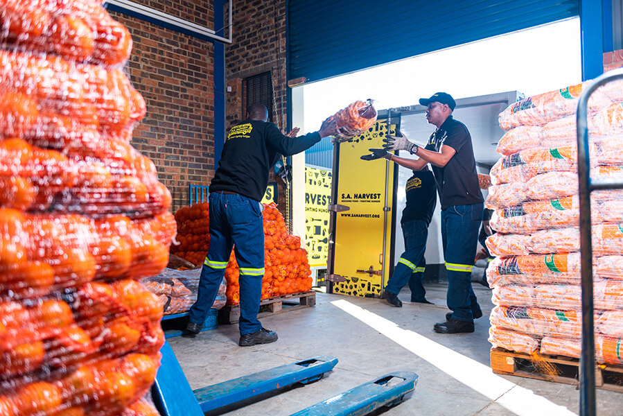SA_Harvest_s_Joburg_team_loading_a_truck_to_deliver_vegetables_from_OneFarm_Share_to_beneficiaries._Photo_credit_Mpumelelo_Mcau.jpg