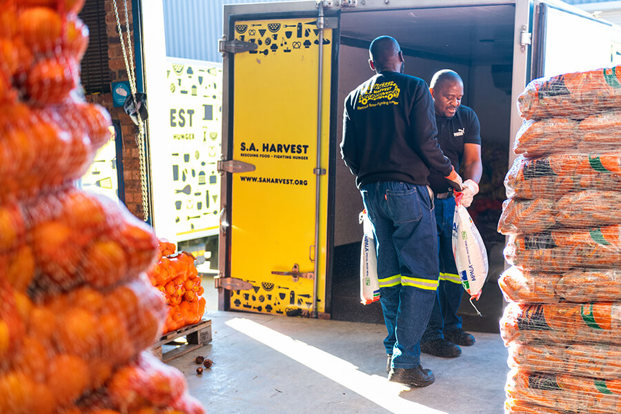 SA_Harvest_s_Joburg_team_loading_a_truck_to_deliver_vegetables_from_OneFarm_Share_to_beneficiaries_2._Photo_credit_Mpumelelo_Mcau.jpg