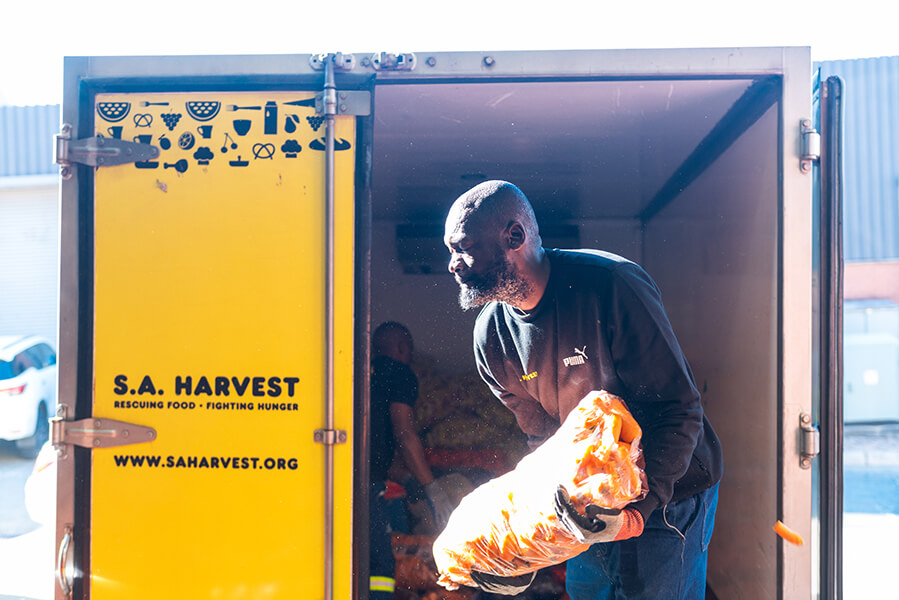 SA_Harvest_s_Leslie_Mthethwa_loading_truck_to_deliver_vegetables_from_OneFarm_Share_to_beneficiaries._Photo_credit_Mpumelelo_Mcau.jpg