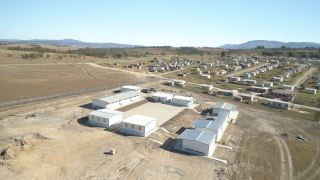 A huge improvement. An aerial view of Zamukhanyo School consisting                          of Kwikspace’s modular units ensures that 300 learners, teachers and                          administrative personnel are housed in an environment conducive to                         learning.