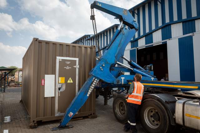 Technicians load BlueNova&#039;s iESS (intelligent Energy Storage System) onto a truck as it is prepared to be sent to Timibila Nature Reserve in Namibia. The 1MWh battery will form the heart of a solar powered, off grid solution for the reserve. 