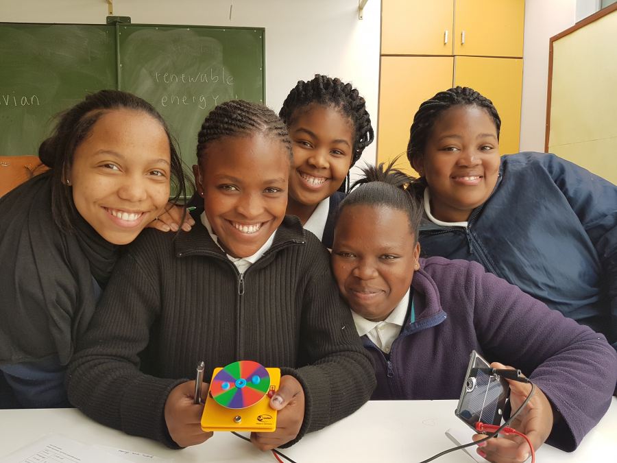 Grimley School students proudly running a small motor with solar energy.