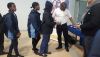 Sizwe Nzima, founder of Iyeza Health, hands out sanitary packages to Oaklands pupils. 