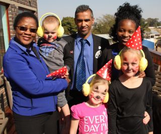 Hirsch&#039;s team members with some of the kids at the Manger Care Centre