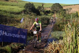   Julian Jessop leads the field across a floating bridge early in the HusqvarnaClassic Mid-Illovo MTB Challenge and Trail Run.