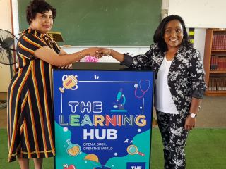 Seen at the handover event was Principal Mrs Pillay with Loshnee Bridgmohan of THE HUB