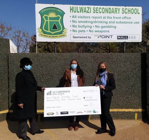 Reaching out to schools:  Mrs Jele (School Principal of Hulwazi Secondary School), together with Nobambo Goduka (Senior Marketing Manager at Broll Property Group for SA Corp) and Audrey Nkunzi (Property Manager at Broll Property Group for SA Corp) at the recent handover at Hulwazi Secondary School. Despite all the upheavals over the past two months. Town Square, together with several  other SA corporate owned shopping centres, has been steadfast in its support for the Our Schools SOS Campaign and recently celebrated a combined R67 000 donation to Hulwazi Secondary School. 