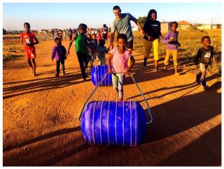 David Barnard visiting a community in Hammanskraal with Youthzones and Hippo Roller