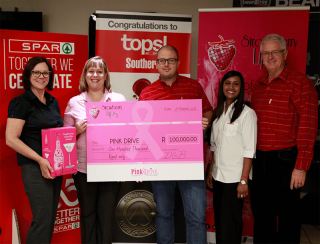 Strawberry Lips hands over donation to PinkDrive