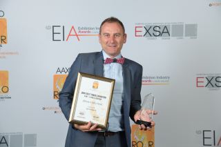 Spintelligent&#039;s MD David Ashdown with one of the four awards the company won at the AAXO ROAR ceremony.