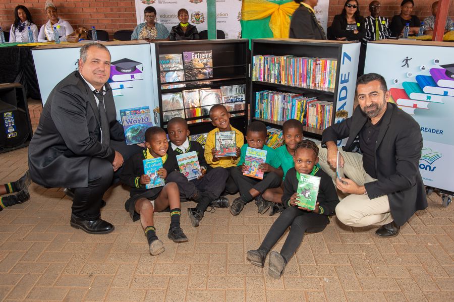 Mr Mossie Mostert GM of Paarl Coldset and Novus Holdings and Ahmed Motala CEO of New Africa Education Foundation during the Mobile Library handover at the school