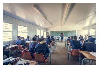 Classrooms are 7 X 7 m structures that includes windows, electrical lighting, plug                  points, and chalk and pin boards and can accommodate 30+ learners.