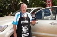 Winner of the 2014 Shoprite Checkers Championship Boerewors competition, Koos van Dyk, shows off his grand prize, a brand new Toyota Hilux.