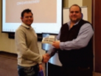 Michael Shackleton, Legal Executive at Credit Intel, receiving an iPad Mini in the AJS Raffle held at the 2014 Gauteng ADRA Roadshow