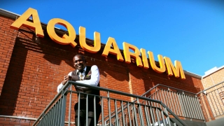 Mzukisi Lembeni, managing director of  tour operator company iMzu Tours  and graduate of the College of Magic, poses at the Two Oceans Aquarium where he kicked off his tourism career. He&#039;ll be jetting off to the USA for a book tour this Tourism Month.