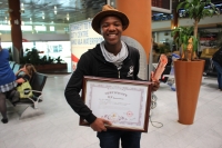 A proud Anele  Dyasi ( 17) shows off his Bronze Award for Close-up Magic Certificate upon his return to Cape Town from the International College Magic Convention in China.