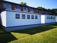 A rear view of some of the completed classrooms at one of the KZN schools                         that benefitted from phase one of the project.