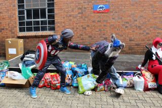 Captain America ensuring a wolf doesn&#039;t run off with the SPCA&#039;s dogfood