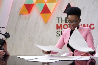 Tumelo Mothotoane tries to read the headlines without the printed word