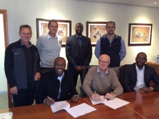 Pictured at the enterprise development agreement signing are  (Top row from left): Ralph Palphramand, Hytec Regional Manager; Mike Harrison, Hytec General Manager; Vusi Mashele, BNP Financial Manager; Frikkie de Klerk, Hytec Branch Manager, Witbank.  (Bottom row from left:) Patrick Mgidi, BNP Technical Manager; John Wingrove, Hytec CEO; and Piet Makama, BNP Managing Director.