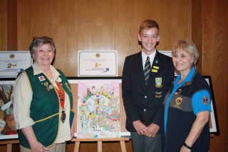 1st Prize Winner Keagan Larkin from Kirstenhof Primary School flanked by our District Governor Moira Theron on  the left and MDC Yolanda de Jager 