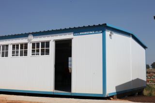 Double-wide prefabricated modular units. Six of these and four single-                        wide were the first operational buildings to be placed on site.